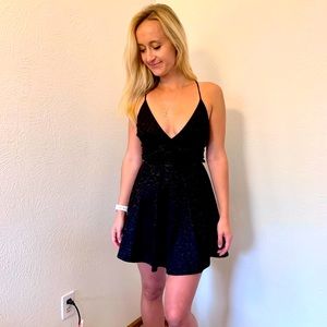 Lace deep cut dress.